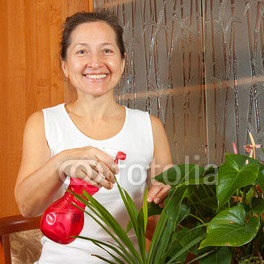 Mature_woman_potted_plants_sprinkles.jpg